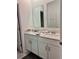 Bathroom features dual vanity sinks with white cabinets, providing functionality and style at 3966 Willowbrook Dr, Edgewater, FL 32141