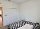 Cozy bedroom featuring a comfortable bed and a spacious closet for ample storage solutions at 3966 Willowbrook Dr, Edgewater, FL 32141