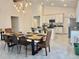Bright dining area featuring an elegant light fixture and an inviting atmosphere at 3966 Willowbrook Dr, Edgewater, FL 32141