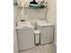 Functional laundry room equipped with a washer, dryer, and storage shelf for efficient laundry tasks at 3966 Willowbrook Dr, Edgewater, FL 32141