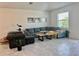 Comfortable living room with neutral tones, large window, and stylish decor, perfect for relaxation at 3966 Willowbrook Dr, Edgewater, FL 32141