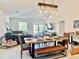Bright living area featuring an open floor plan with a dining area and comfortable seating at 3966 Willowbrook Dr, Edgewater, FL 32141