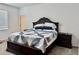 Comfortable main bedroom features a large bed with patterned quilt and dark wood furnishings at 3966 Willowbrook Dr, Edgewater, FL 32141