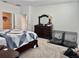 Spacious main bedroom features a dresser, a mirror and closet with neutral-toned carpet at 3966 Willowbrook Dr, Edgewater, FL 32141