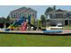 Community playground featuring slides, climbing structures, and a cushioned surface for ' enjoyment at 3966 Willowbrook Dr, Edgewater, FL 32141