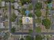 Aerial view of a single Gathering home in a residential neighborhood with mature trees at 417 El Salvador Dr, Lakeland, FL 33809