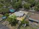Aerial view of a beautiful home featuring a fenced backyard, well maintained yard, and lovely landscaping at 417 El Salvador Dr, Lakeland, FL 33809