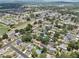 Expansive aerial view of a residential area with lush greenery, scattered pools, and convenient highway access at 417 El Salvador Dr, Lakeland, FL 33809