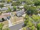 Aerial view of a charming single Gathering home with a fenced in yard and mature trees at 417 El Salvador Dr, Lakeland, FL 33809