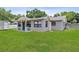 A well maintained backyard with large lawn and a storage shed at 417 El Salvador Dr, Lakeland, FL 33809