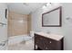 Tiled bathroom with vanity sink and shower-tub combination at 417 El Salvador Dr, Lakeland, FL 33809