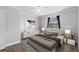 Well-lit bedroom with wood floors, contemporary decor, and a calm, inviting atmosphere at 417 El Salvador Dr, Lakeland, FL 33809