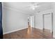 Clean bedroom with neutral walls and wood floors with adjacent closet and door at 417 El Salvador Dr, Lakeland, FL 33809