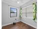 Small bedroom with natural light and hardwood floors at 417 El Salvador Dr, Lakeland, FL 33809