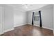 Spacious bedroom with wood floors, minimalist design, and natural light at 417 El Salvador Dr, Lakeland, FL 33809