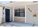 Welcoming front entryway with a navy blue door and decorative stone accents around the window at 417 El Salvador Dr, Lakeland, FL 33809