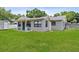 Charming single story home featuring a well maintained lawn, neutral paint, and an inviting porch at 417 El Salvador Dr, Lakeland, FL 33809
