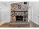 Classic brick fireplace with mantle and hearth, perfect for cozy evenings at 417 El Salvador Dr, Lakeland, FL 33809
