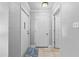 Bright foyer with tile flooring and multiple white doors leading to various rooms in the home at 417 El Salvador Dr, Lakeland, FL 33809
