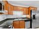 Modern kitchen featuring stainless steel appliances, granite countertops, and subway tile backsplash at 417 El Salvador Dr, Lakeland, FL 33809