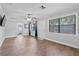 Open concept living room with wood floors and plenty of natural light at 417 El Salvador Dr, Lakeland, FL 33809