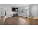 Bright and open living space featuring hardwood flooring, neutral walls, and a large window at 417 El Salvador Dr, Lakeland, FL 33809