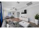 Cozy living room featuring contemporary furnishings, stylish decor, and hardwood flooring at 417 El Salvador Dr, Lakeland, FL 33809