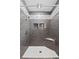 Updated tiled shower with built-in niche and bench, perfect for relaxation at 417 El Salvador Dr, Lakeland, FL 33809
