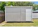 A view of the home's storage shed and fenced yard at 417 El Salvador Dr, Lakeland, FL 33809