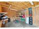 Storage shed with plywood walls and ceiling, wood shelves and plastic storage boxes, tools and equipment at 417 El Salvador Dr, Lakeland, FL 33809