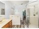 Bathroom boasts a glass shower, wood vanity, and access to a walk-in closet at 436 Lady Diana Dr, Davenport, FL 33837