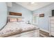 Comfortable bedroom with wood-look floors and soft blue walls at 436 Lady Diana Dr, Davenport, FL 33837