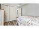 This bedroom features wood floors, closet, and access to bathroom at 436 Lady Diana Dr, Davenport, FL 33837