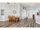 Dining area with wood floors, high ceilings, dining table and bright windows at 436 Lady Diana Dr, Davenport, FL 33837