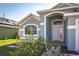Home with beautiful arched doorway and nicely landscaped front yard, a welcoming entrance at 436 Lady Diana Dr, Davenport, FL 33837