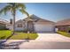 Charming home with well-maintained landscaping, two car garage and inviting front door at 436 Lady Diana Dr, Davenport, FL 33837