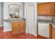 Open kitchen featuring granite countertops, wooden cabinets, and modern appliances, overlooking the dining area at 436 Lady Diana Dr, Davenport, FL 33837