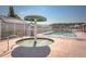 Community pool area with spa, perfect for relaxation and recreation on a sunny day at 436 Lady Diana Dr, Davenport, FL 33837