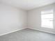 Comfortable carpeted bedroom featuring natural light and neutral paint at 4486 Rapallo Ave, Winter Haven, FL 33884