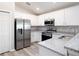 Bright kitchen featuring stainless steel appliances, ample counter space, and white cabinets at 4486 Rapallo Ave, Winter Haven, FL 33884