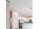Open-concept kitchen with stainless steel appliances, white cabinets, and granite countertops at 4486 Rapallo Ave, Winter Haven, FL 33884