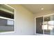 Spacious outdoor patio with a sliding glass door and ample natural light at 4486 Rapallo Ave, Winter Haven, FL 33884