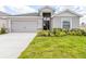 Charming single-story home featuring a two-car garage and well-maintained lawn at 4515 Rapallo Ave, Winter Haven, FL 33884