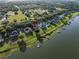 Aerial view of lakeside home featuring mature trees and landscaping at 4808 Juliana Reserve Dr, Auburndale, FL 33823