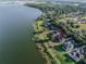 An aerial view of a lakeside home highlighting the private yard and dock at 4808 Juliana Reserve Dr, Auburndale, FL 33823