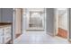 Bathroom featuring a glass door shower, tile flooring, and storage space at 4808 Juliana Reserve Dr, Auburndale, FL 33823