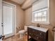 Bathroom featuring a modern vanity, commode, and exterior access at 4808 Juliana Reserve Dr, Auburndale, FL 33823