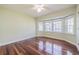 Bright bedroom boasts a bay window, hardwood floors, and a neutral color palette at 4808 Juliana Reserve Dr, Auburndale, FL 33823