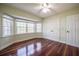 Bedroom with dark hardwood floors and a bay window for ample natural light at 4808 Juliana Reserve Dr, Auburndale, FL 33823