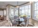 This breakfast nook features large windows offering expansive water views and is adjacent to the kitchen at 4808 Juliana Reserve Dr, Auburndale, FL 33823
